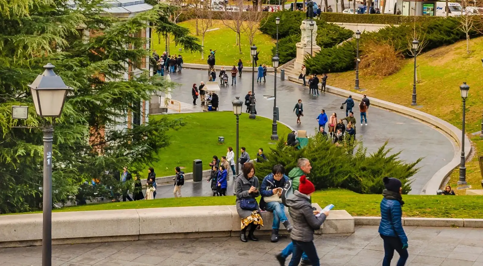 Visitors on paths through a formal Madrid garden